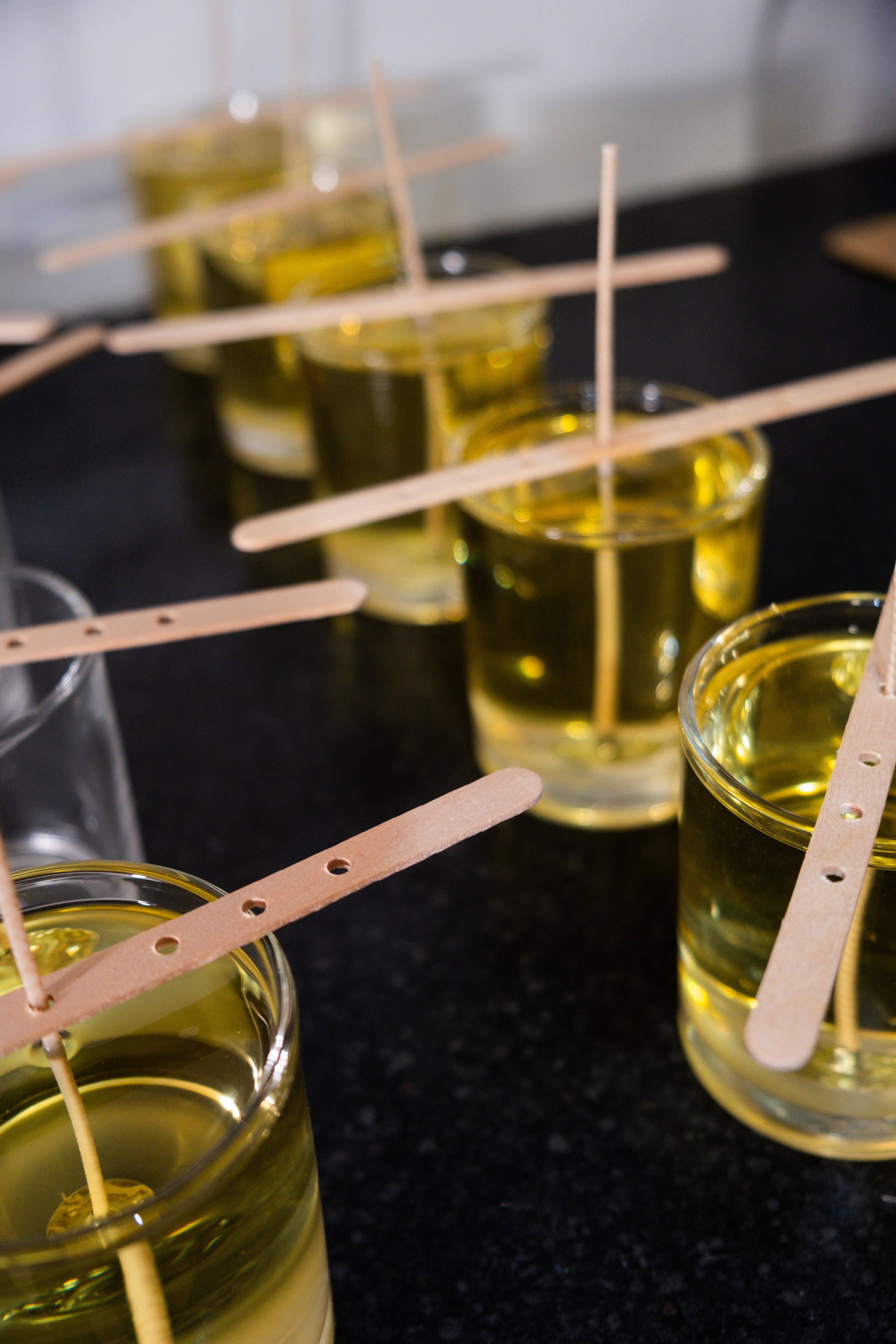 Glass jar of pure natural plant wax melted oil candle making process 